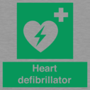 green-background-with-white-text-and-heart-defibrillator-symbol--white-cross-and~